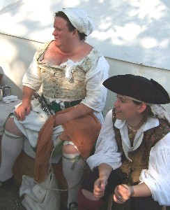 Silkie and Abbington sitting by the tent