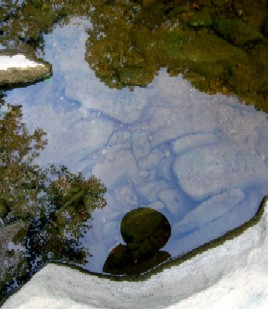 Mission reflected in pool.