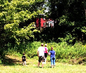 Visitors looking up at John Work house