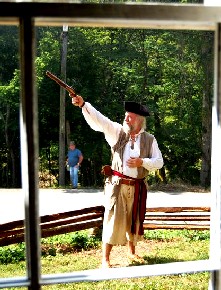 Mark Gist firing outside the window