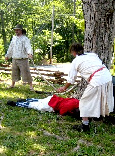 Brigands tentively check dead soldier