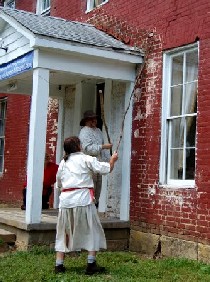 Michael and Clint hit John Work house with sticks