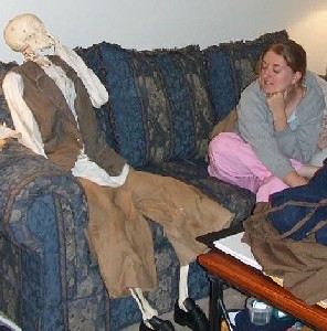 Kate and Bucky the skeleton with his hand to his face