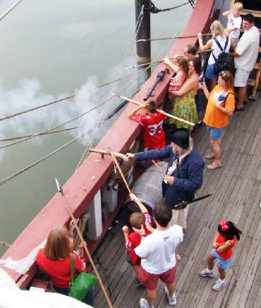 Mark fires his pistol at the pirates