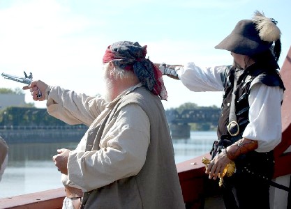 Callenish Gunner and Shannon fire at the pirates