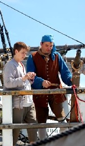 Andrew and Mission contemplate the deck gun