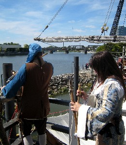Trish holds the gun implements while Mission fires the deck gun