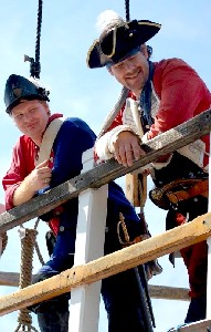 Marty and John watch the battle with sardonic grins