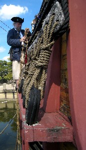 Mark securing something to the side of the Santa Maria