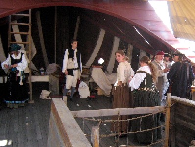 People hanging around the front of the Santa Maria