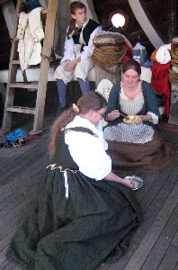 Folks having breakfast on the Santa Maria