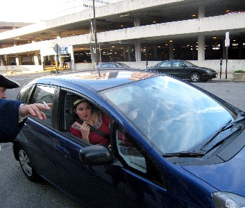People in a little blue car asking for directions