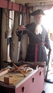 Mark showing a sword to the audience