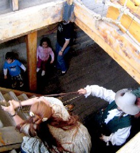 Shannon dragging Blue Jess into the ship's hold