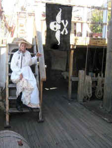 Shay sitting on the steps by the Mercury flag