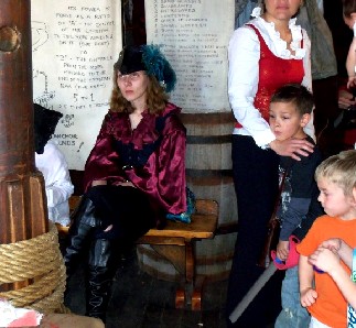 Rosabella and some kids listening to the surgeon