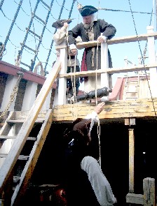 Mark and Bryan hoist the cannon