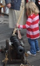 Girl lighting cannon