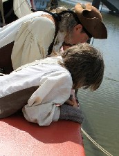 Dennis and Zach look over the side