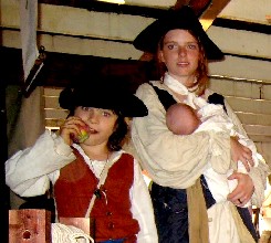 Zach eating an apple, Danie holding Alexander