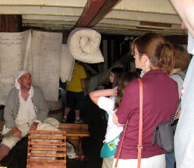 Silas explaining sewing