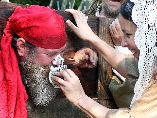 Michelle smooshing MD with a cupcake