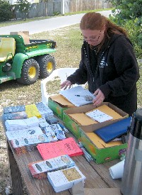 Lily with a fistful of flyers
