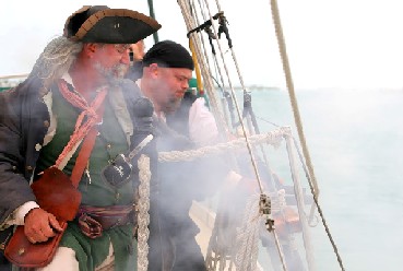 Captain Jim fires from the Jolly Rover II