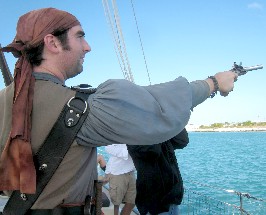 Devlin Firing His Right Pistol