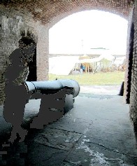 Woman Standing in front of a Cannon