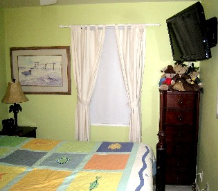 Condo bedroom with shade pulled