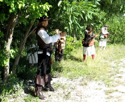 Small Arms Men Waiting in Shade