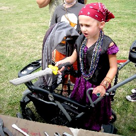 Girl with sword at surgeon table