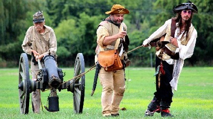 Boys walking their cannon