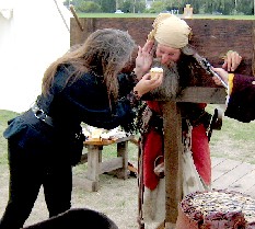 Trish offering Billie his cupcake