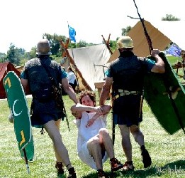 Romans drag prisoner off