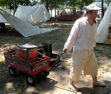 Michael Bagley hauls the surgeon's box of instruments in a wagon
