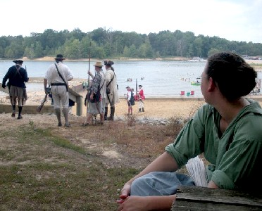 Rosanne watching guys with period guns