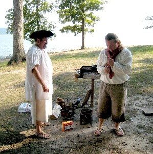 Dan Needham and Michael Bagley starting a fire