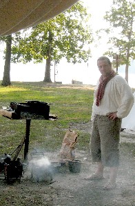 Michael looking satisfied with fire he started