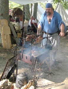 Guy making skewered chicken