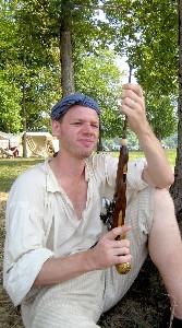 Sam cleaning his gun