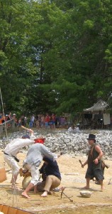 People fighting on beach
