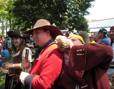 The guy blowing the conch shell in Michael's ear