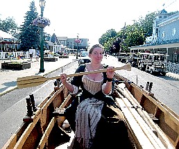 Kate rowing down the street