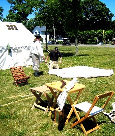 Michael shows Bryan how to set up his tent