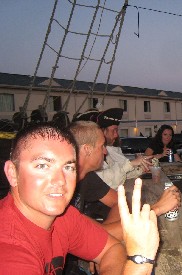 Guy at pirate bar flashing peace