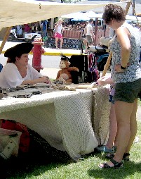 Becci with kid at Kid's Booth