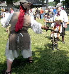 M.A. d'Dogge sword fights the cowboy