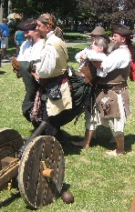 Trish being carried to the stocks